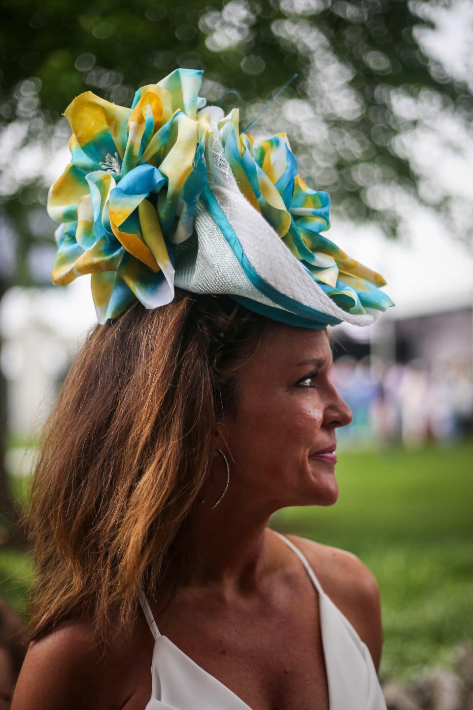 Tonya Johnson wears a hat made by Christine A. Moore Hats during Kentucky Derby race day at Churchill Downs in Louisville, Ky. on Saturday, May 4, 2019. 