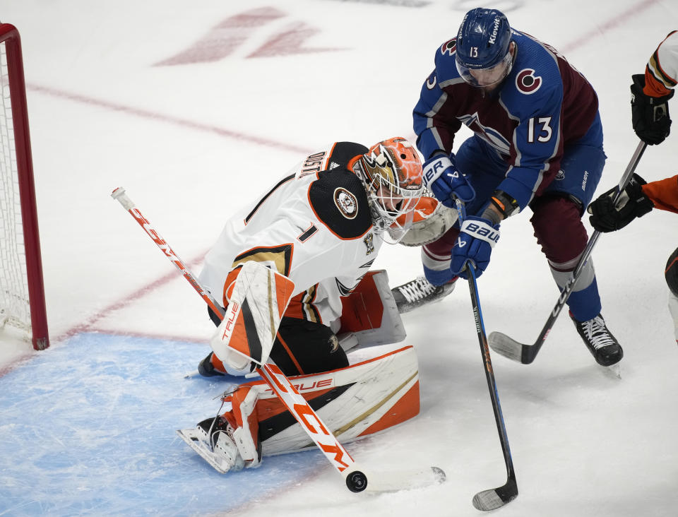 Anaheim Ducks goaltender Lukas Dostal, left, makes a stick save of a shot from Colorado Avalanche right wing Valeri Nichushkin in the first period of an NHL hockey game Wednesday, Nov. 15, 2023, in Denver. (AP Photo/David Zalubowski)