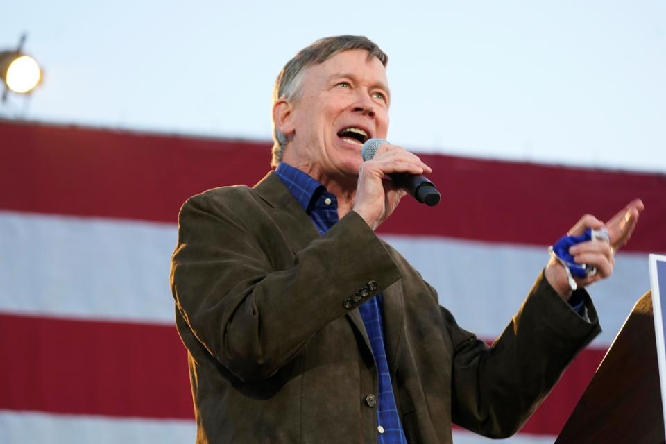 John Hickenlooper speaks at a rally in Denver on Oct. 8, 2020. Hickenlooper posted huge quarterly fundraising numbers in his bid to unseat Republican Sen. Cory Gardner.