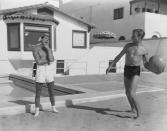 <p>Randolph Scott and Cary Grant play with a ball at their shared beach house in 1935. </p>