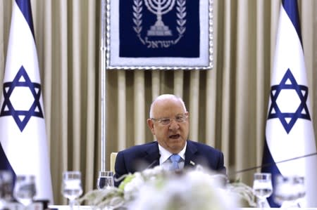 Israeli President Reuven Rivlin speaks as he meet members of the Likud Party as he began talks with political parties over who should form a new government, at his residence in Jerusalem