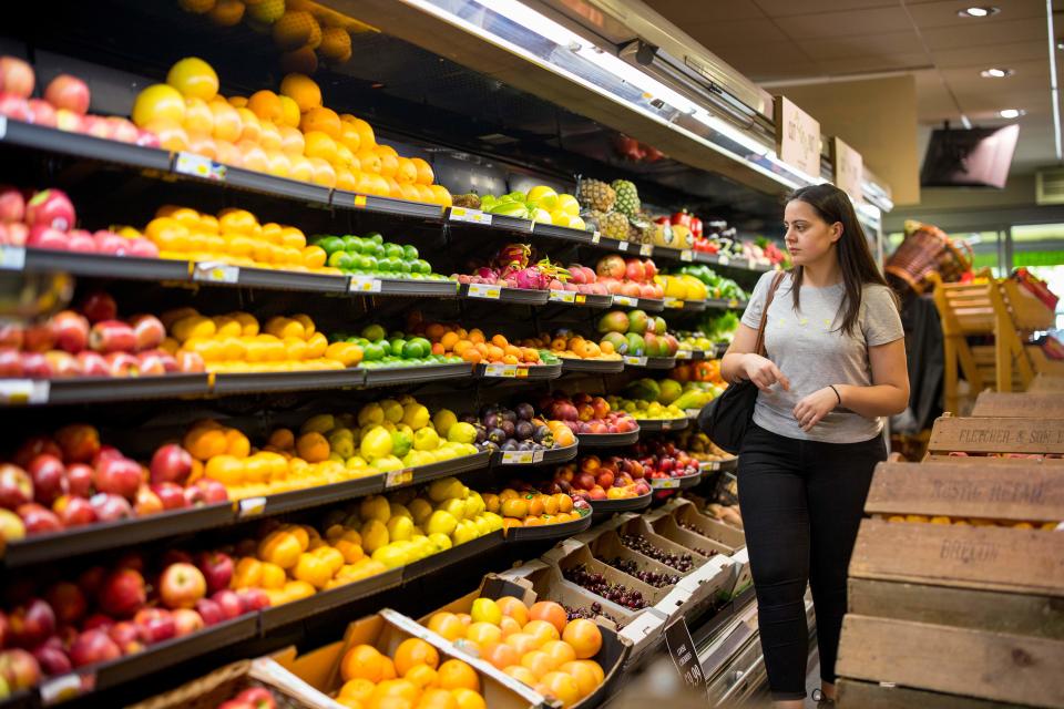 ftse People browse the shelves with loose un-packaged fruit at Budgens supermarket in Belsize Park, north London on July 2, 2019. - British supermarkets are starting to go 