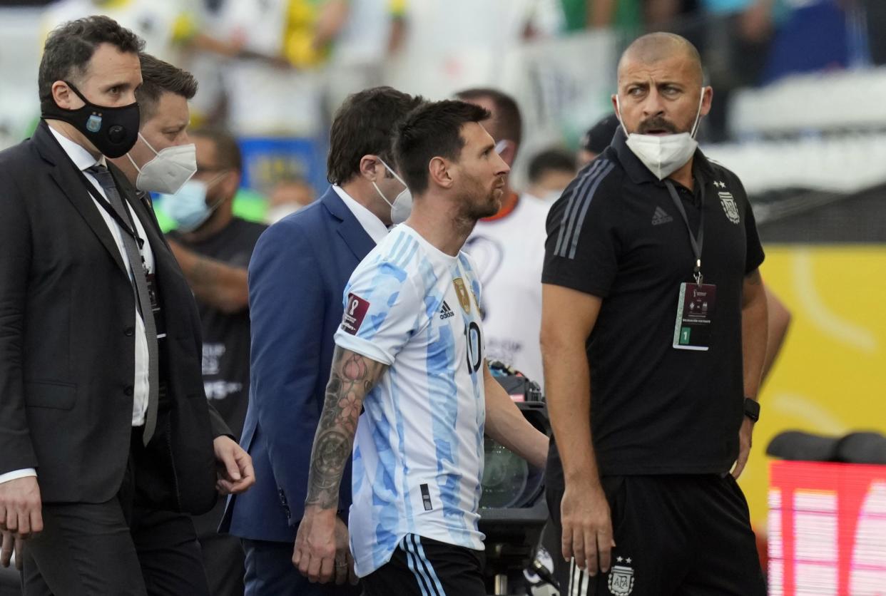 Argentina's Lionel Messi walks off the field after the qualifying soccer match for the FIFA World Cup Qatar 2022 against Brazil was interrupted by health officials in Sao Paulo, Brazil, Sunday, Sept. 5, 2021.