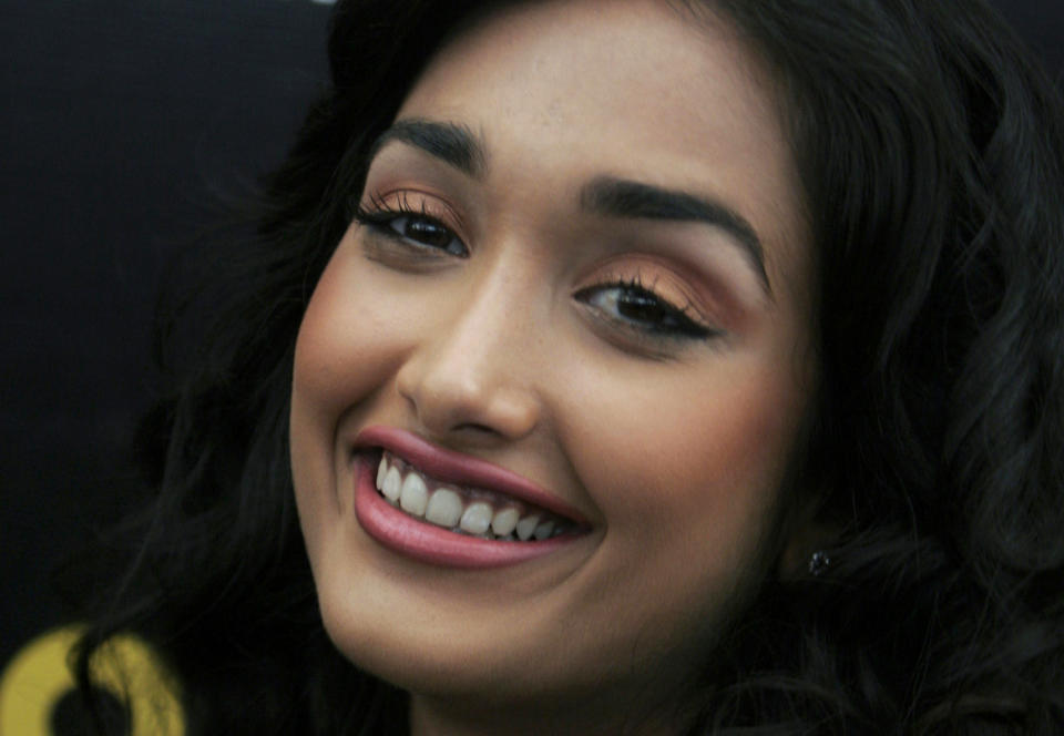 FILE - In this Dec. 19, 2008 file photo, Bollywood actress Jia Khan smiles during a promotional event of her forthcoming Hindi movie "Ghajini" in Bangalore, India. Police said the son of a Bollywood couple was arrested Monday, June 10, 2013 on suspicion of abetting the suicide of Khan. (AP Photo/Aijaz Rahi, File)