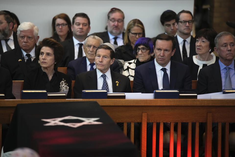 Current and former elected officials including Senators Richard Blumenthal and Chris Murphy, Congresswoman Rosa DeLauro, and Senator Susan Collins listen to reflections during the funeral for former Senator Joe Lieberman in Stamford, Conn., Friday, March. 29, 2024. (AP Photo/Bryan Woolston)