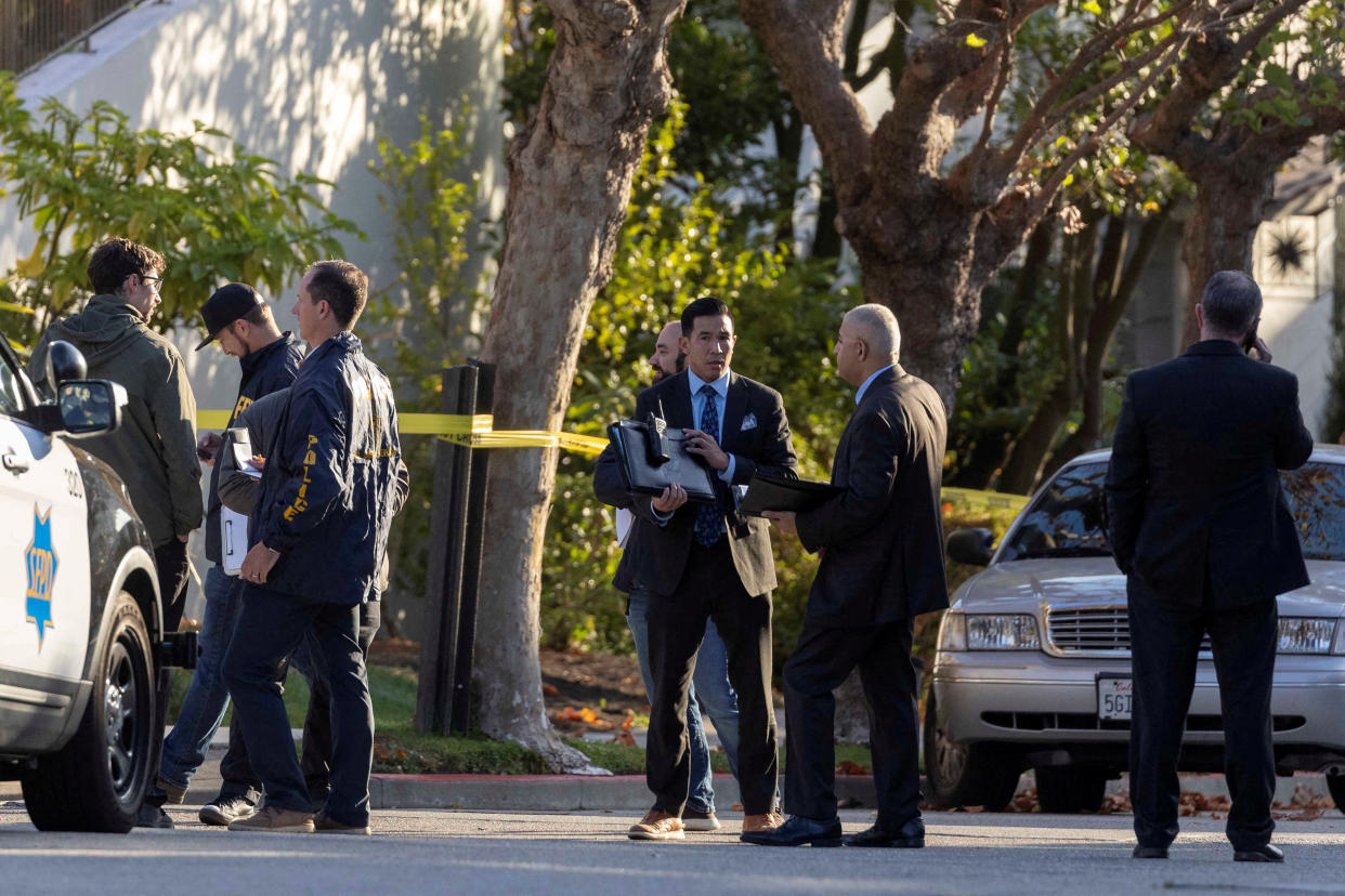 Members of law enforcement work outside the home of U.S. House Speaker Nancy Pelosi where her husband Paul Pelosi was violently assaulted after a break-in at their house, according to a statement from her office, in San Francisco, California, U.S., October 28, 2022.  REUTERS/Carlos Barria