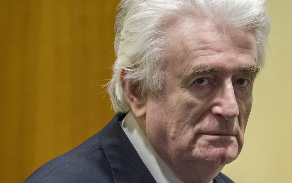 Radovan Karadzic waits to hear the final verdict in his March 2019 trial at the Hague