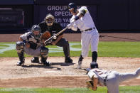 New York Yankees' Aaron Judge hits an RBI single off Detroit Tigers starting pitcher Spencer Turnbull, foreground, in the fifth inning of a baseball game, Saturday, May 1, 2021, in New York. (AP Photo/John Minchillo)