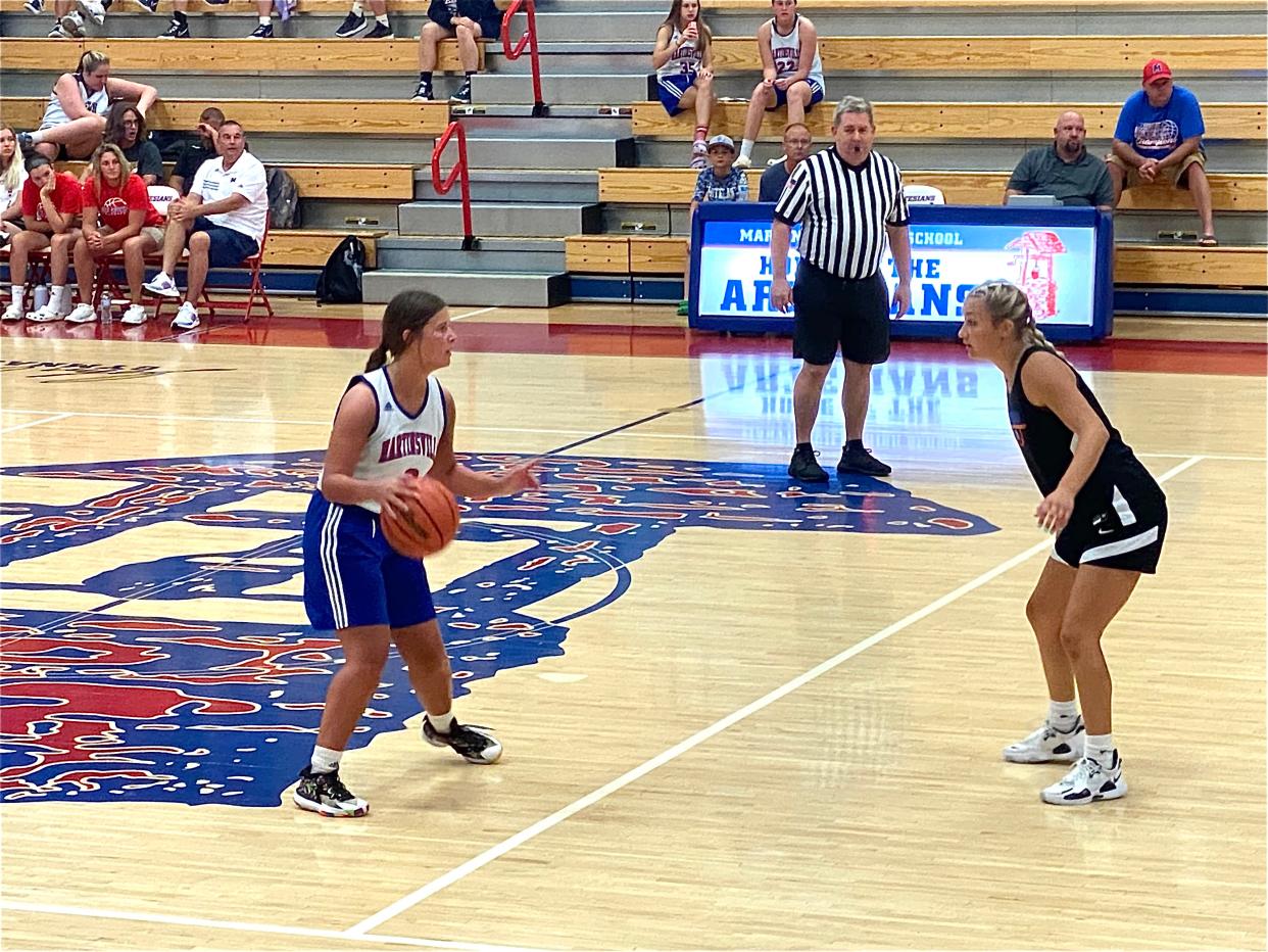 Martinsville's Emma Potter sets a play for the Artesians against Mid-State Conference opponent Whiteland at the Martinsville Shootout on June 29, 2022.