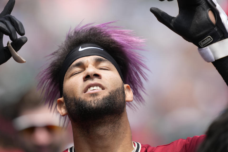 Arizona Diamondbacks designated hitter Lourdes Gurriel Jr. reacts in the dugout after hitting a three-run home run during the fifth inning of a baseball game against the Detroit Tigers, Saturday, June 10, 2023, in Detroit. (AP Photo/Carlos Osorio)