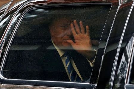 Republican U.S. presidential candidate Donald Trump departs after he was deposed for a lawsuit involving partners in a restaurant venture at offices in Washington, U.S. June 16, 2016. REUTERS/Jonathan Ernst