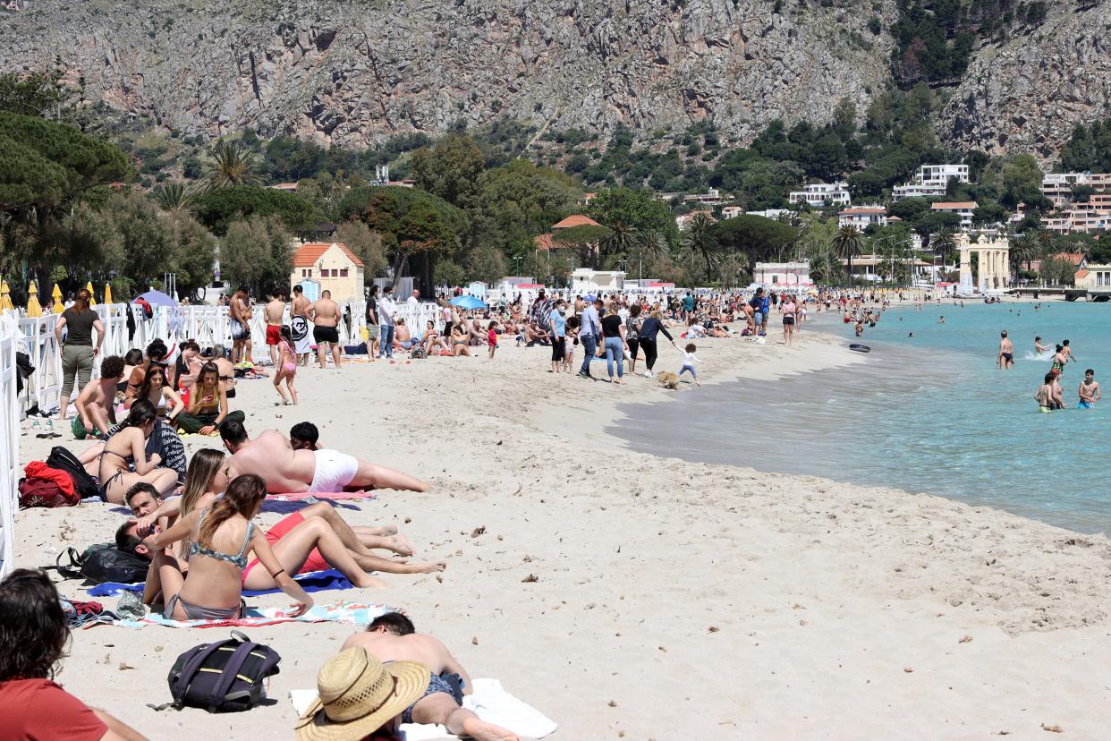 A view of the beach of Mondello, Sicily, crowded with sunbathers after the slowdown of the COVID virus allowed the reopening of beaches in Sicily.