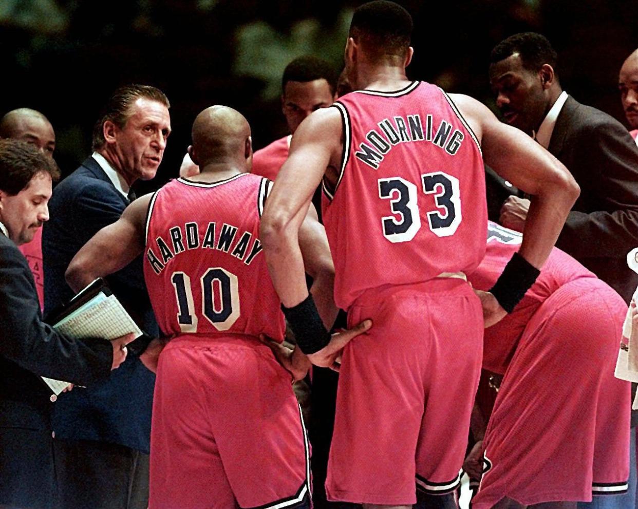 Pat Riley talks with his players as coach of the Miami Heat in 1996.