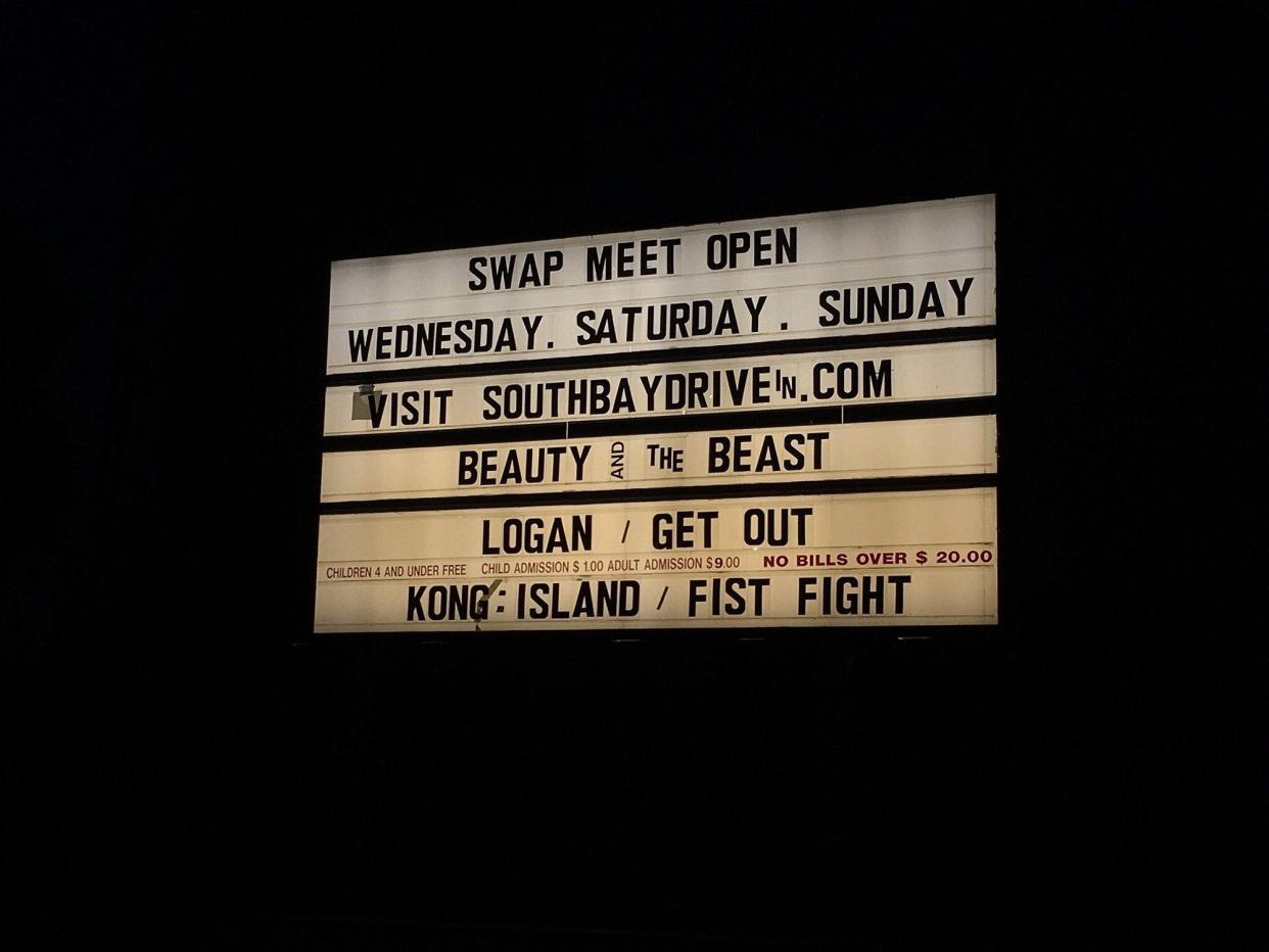 San Diego South Bay Drive-In sign advertising show times for Get Out and Beauty and the Beast.