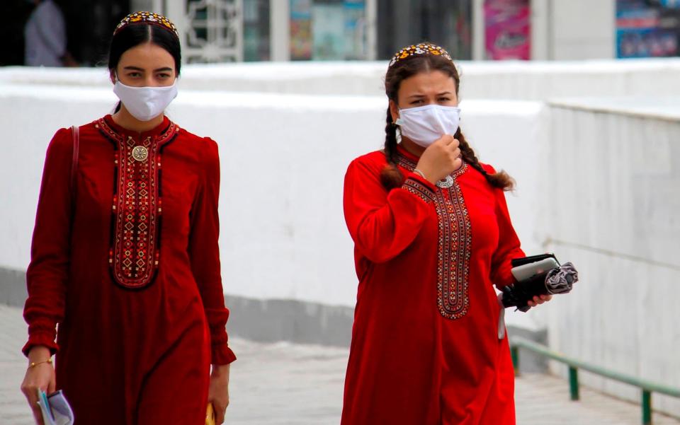 Women in Turkmenistan wear masks because of 'dust' - AFP