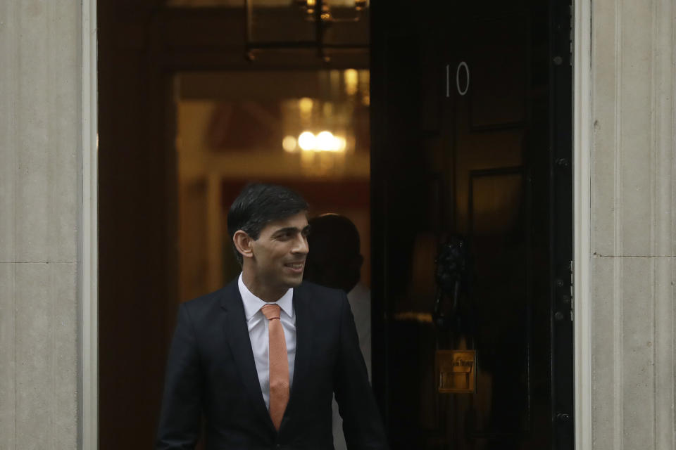 FILE - Britain's new Chancellor of the Exchequer Rishi Sunak leaves 10 Downing Street, in London, Thursday, Feb. 13, 2020. Two people are running to be Britain’s next prime minister, but a third presence looms over the contest: Margaret Thatcher. Almost a decade after her death, the late former prime minister casts a powerful spell over Britain's Conservative Party. In the race to replace Boris Johnson as Conservative leader and prime minister, both Foreign Secretary Liz Truss and former Treasury chief Rishi Sunak claim to embody the values of Thatcher. (AP Photo/Matt Dunham, File)