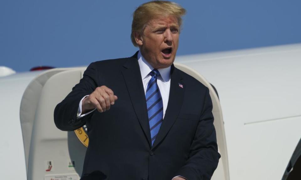 Donald Trump calls out as he arrives on Air Force One in New Jersey on Friday, en route to his Bedminster golf club.