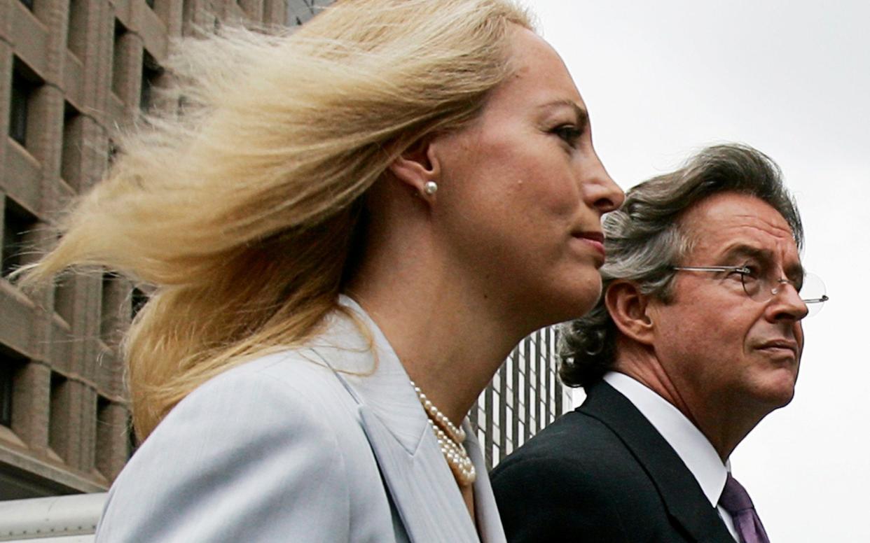 Former CIA operative Valerie Plame and her husband Joseph Wilson leave a news conference at the National Press Club in Washington in July 2006. - REUTERS