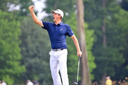 Apr 26, 2015; Avondale, LA, USA; Justin Rose celebrates as he sinks a birdie on the 18th green during the final round of the Zurich Classic at TPC Louisiana. Derick E. Hingle-USA TODAY Sports