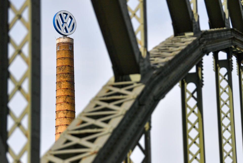 28 April 2020, Saxony-Anhalt, Halle (Saale): The Volkswagen logo turns on a chimney at the Volkswagen Centre in Halle/Saale. After a corona-related stop, Volkswagen gradually ramps up production at its plants again. Photo: Hendrik Schmidt/dpa-Zentralbild/dpa (Photo by Hendrik Schmidt/picture alliance via Getty Images)