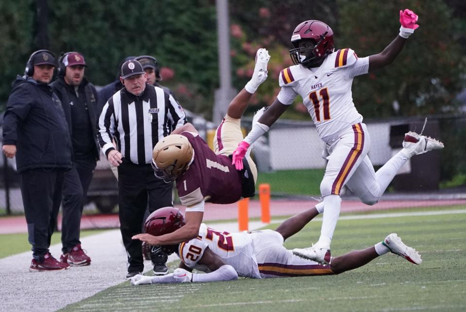 Iona Prep quarterback Joey Gaston (1) is tackled during their 46-35 win over Cardinal Hayes (Bronx, N.Y.) in football action at Iona Prep High School in New Rochelle on Saturday, October 14, 2023.