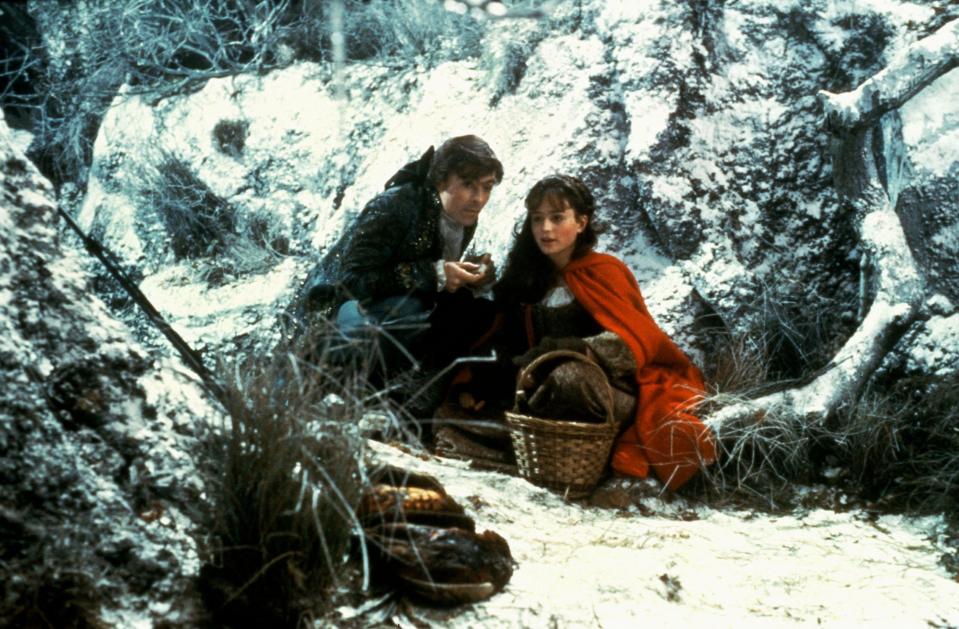 A young woman and her potential suitor picnic in a snowy woodland in "The Company of Wolves"