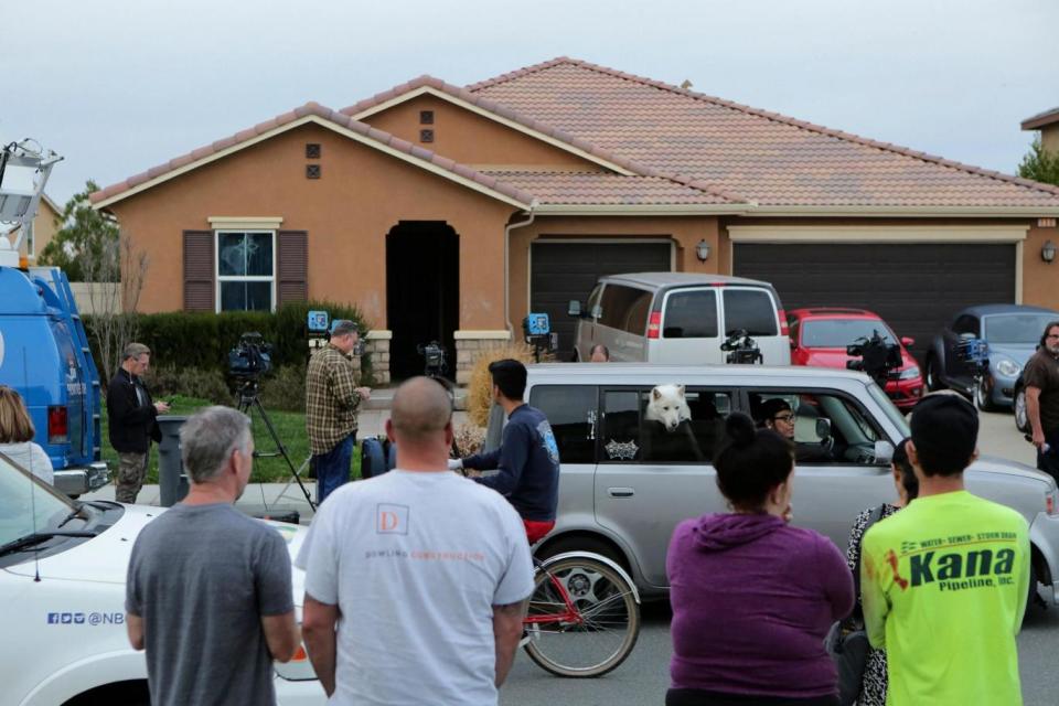 Residents gathered outside the California home after 13 children were found held captive (AFP/Getty Images)