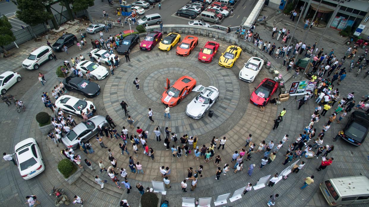 A boss organized a two billion RMB (about 314 million USD) group of over 20 luxury sports cars including Lamborghini LP700 and limited edition Benz cars to promote the opening of a resort on September 12, 2015 in Changsha, Hunan Province of China.
