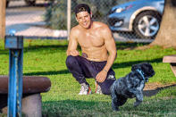 <p>Gregg Sulkin works out in L.A. on Wednesday with the help of a furry friend at the park. </p>