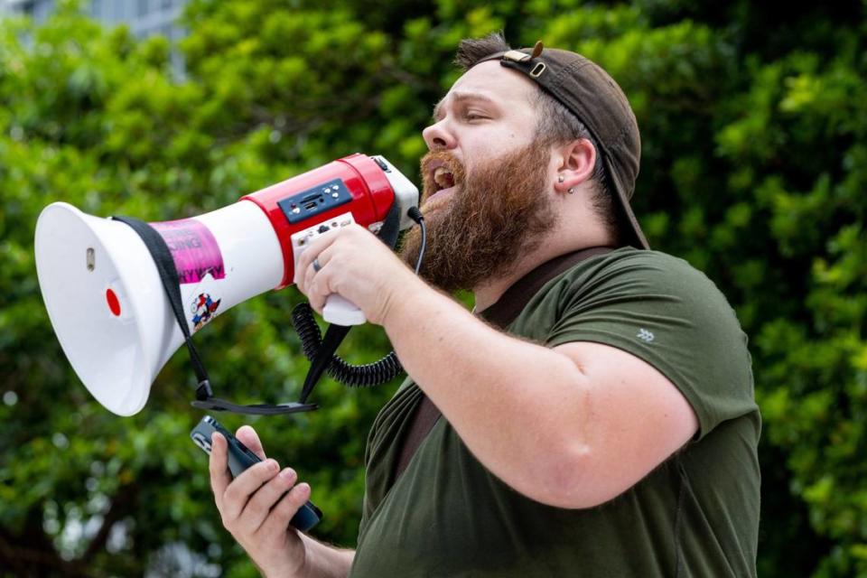 Party for Socialism and Liberation representative Craig Birtchfield, 30, speaks to protesters at Brickell Park in Miami, Florida, on Wednesday, May 24, 2023.