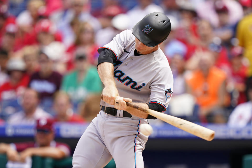 Miami Marlins' Joey Wendle hits a run-scoring single against Philadelphia Phillies pitcher Kyle Gibson during the second inning of a baseball game, Thursday, Aug. 11, 2022, in Philadelphia. (AP Photo/Matt Slocum)