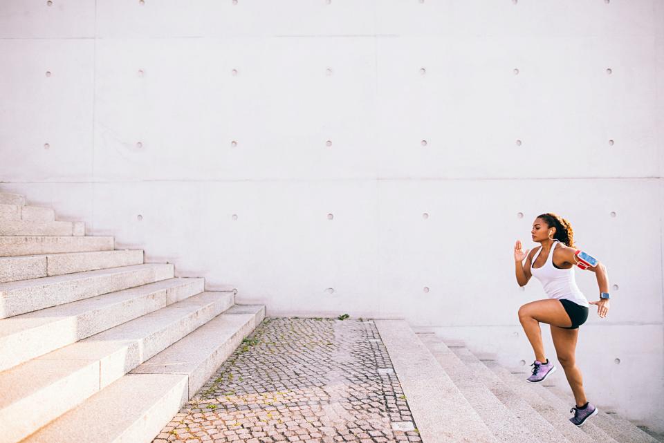 A woman running up the stairs