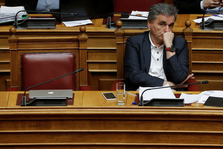 Greek Finance Minister Euclid Tsakalotos looks on during a parliamentary session before a vote on tax breaks in Athens, Greece, May 15, 2019. REUTERS/Constantina Peppa