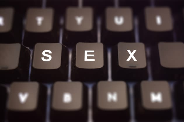 Sex online concept. Sex text written on keypad. Black keys with white letters message for cybersex on pc keyboard. Blur buttons background. - Credit: Getty Images/iStockphoto