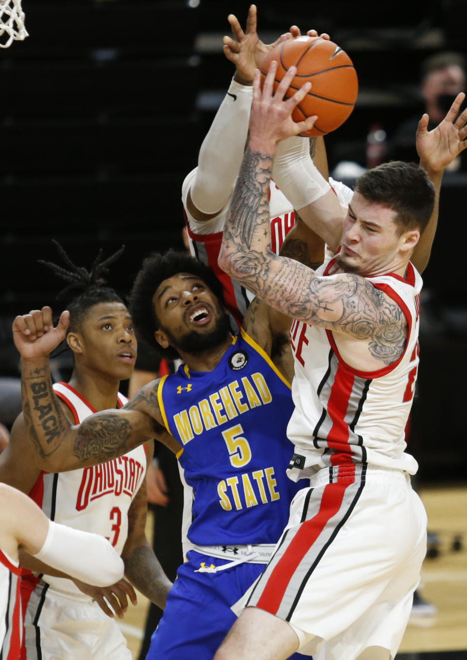 Morehead State forward James Baker (5) works for a rebound against Ohio State forward Kyle Young during the first half of an NCAA college basketball game in Columbus, Ohio, Wednesday, Dec. 2, 2020. (AP Photo/Paul Vernon)