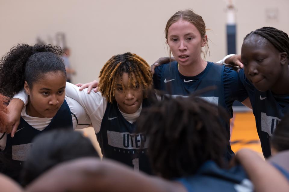 N'yah Boyd (No. 1) and Avery Crouse huddle during a UTEP women's basketball practice at the Foster & Stevens Basketball Complex