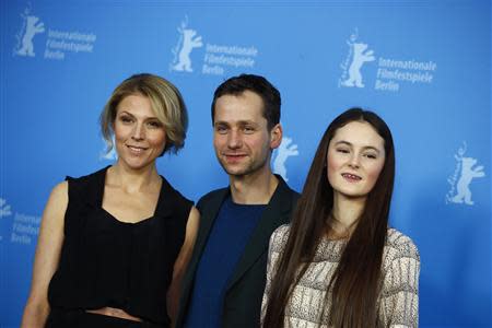 Cast members Franziska Weisz (L), Florian Stetter (C) and Lea van Acken pose during a photocall to promote the movie Kreuzweg (Station of the Cross) at the 64th Berlinale International Film Festival in Berlin February 9, 2014. REUTERS/Thomas Peter