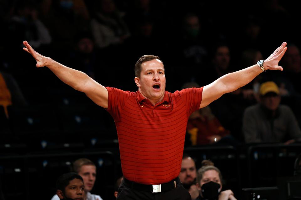 Iowa State coach T. J. Otzelberger directs the team against Xavier during the first half of an NCAA college basketball game in the NIT Season Tip-Off tournament Wednesday, Nov. 24, 2021, in New York. (AP Photo/Adam Hunger)