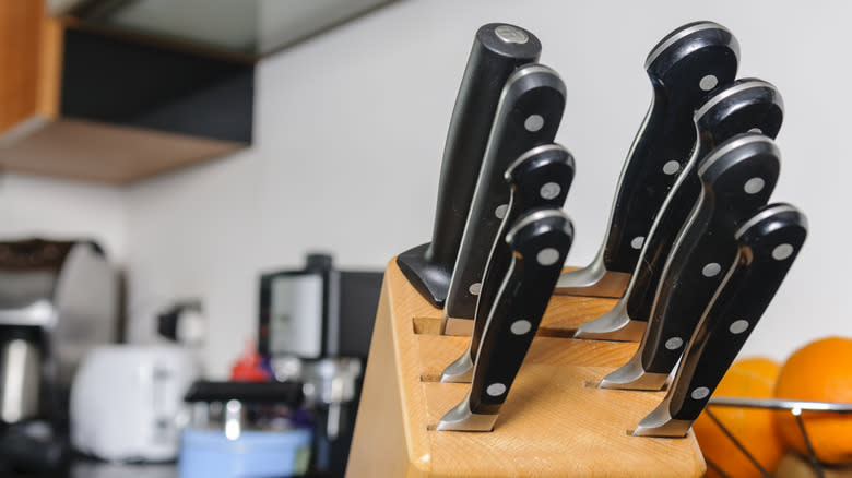 A filled wooden knife block