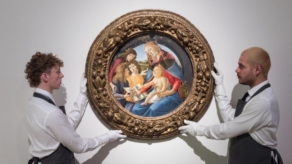 Christie's handlers show Botticelli's paining of the Madonna with child, part of the Paul Allen's art collection, which sold for $48.48 million. 