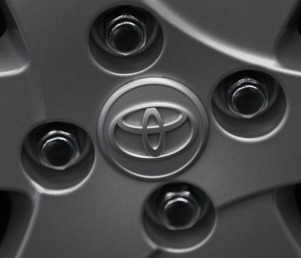 <p><b>Toyota</b></p>There are three ovals in the logo, the two perpendicular ovals inside the larger oval represent the heart of the customer and the heart of the company. They are overlapped to represent a mutually beneficial relationship and trust between each other.<p>The overlapping of the two perpendicular ovals inside the outer oval symbolize "T" for Toyota, as well as a steering wheel, representing the vehicle itself and the outer oval symbolizes the world embracing Toyota. This logo of Toyota was introduced in October of 1989 to commemorate the 50th year of the company.</p><p>(Photo: Reuters Pictures)</p>