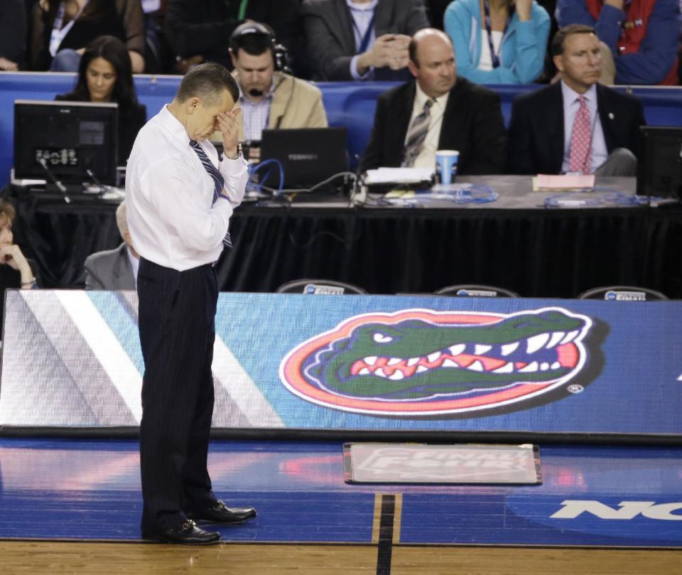 Florida head coach Billy Donovan reacts during the second half of an NCAA Final Four tournament college basketball semifinal game against Connecticut Saturday, April 5, 2014, in Arlington, Texas. Connecticut won 63-53. (AP Photo/Tony Gutierrez)