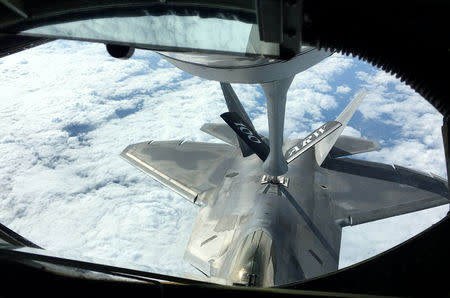 One of two U.S. Air Force F-22 stealth fighter jets receives fuel mid-air from a KC-135 refueling plane over Norway en route to a joint training exercise with Norway's growing fleet of F-35 jets August 15, 2018. REUTERS/Andrea Shalal