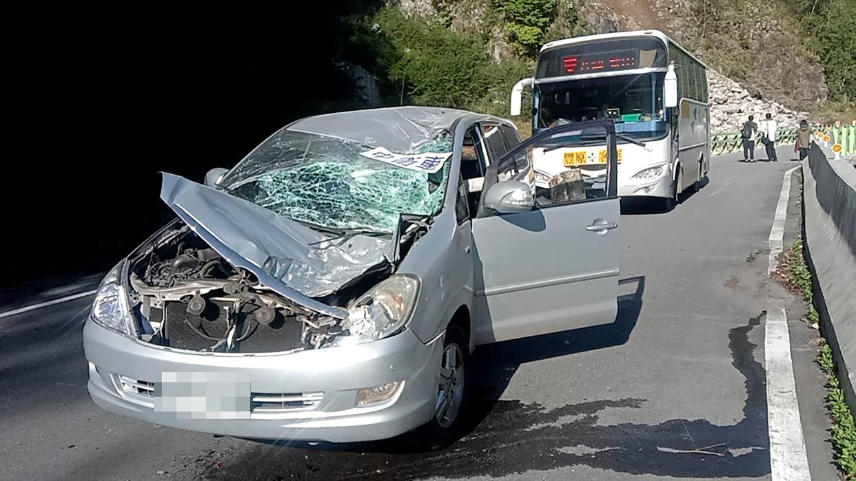 A  heavily damaged car.