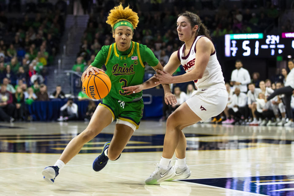 FILE - Notre Dame guard Hannah Hidalgo (3) drives against Virginia Tech guard Georgia Amoore (5) during the second half of an NCAA college basketball game Thursday, Feb. 29, 2024, in South Bend, Ind. Hidalgo was selected to The Associated Press All-America women’s NCAA college basketball first team, Wednesday, March 20, 2024. (AP Photo/Michael Caterina, File)