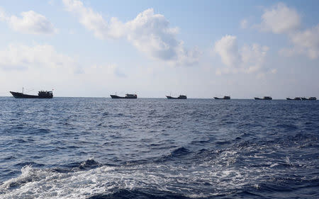 Chinese boats fish at the disputed Scarborough Shoal April 5, 2017. Picture taken April 5, 2017 REUTERS/Erik De Castro