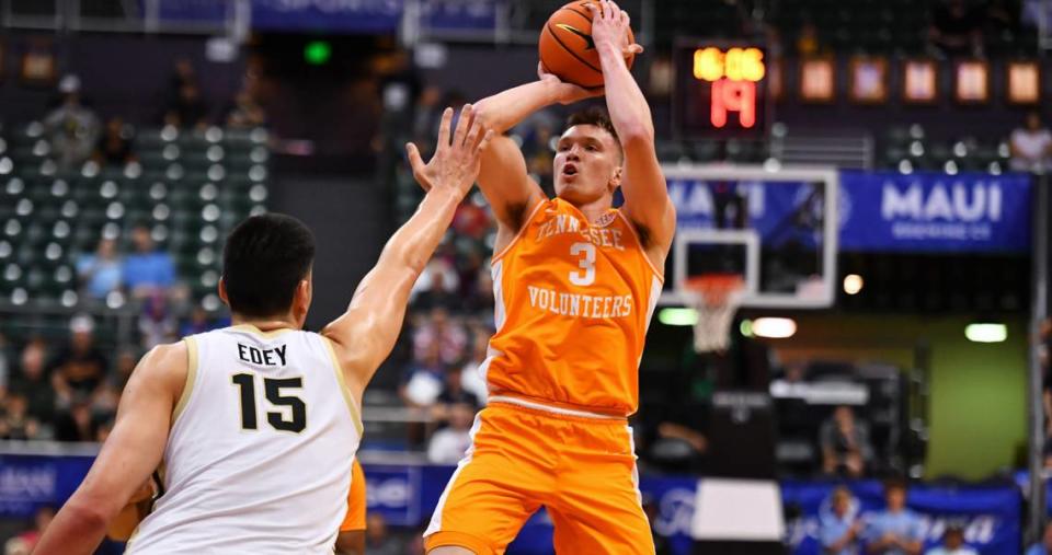 Tennessee Volunteers guard Dalton Knecht (3) attempts a shot defended by Purdue Boilermakers center Zach Edey (15) during the first period at SimpliFi Arena at Stan Sheriff Center on Nov. 21, 2023.