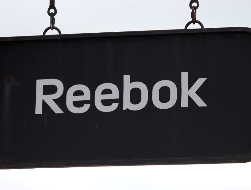 FILE PHOTO: A board with Reebok store logo is seen on a shopping center at the outlet village Belaya Dacha outside Moscow