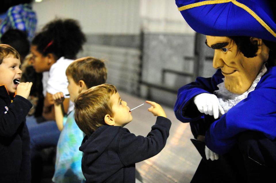 The Westside High School Patriots' mascot amuses children in the stands during halftime of Lucy C. Laney High School's game at Westside in this photo from 2012. Which mascots are the most popular among Georgia high schools?