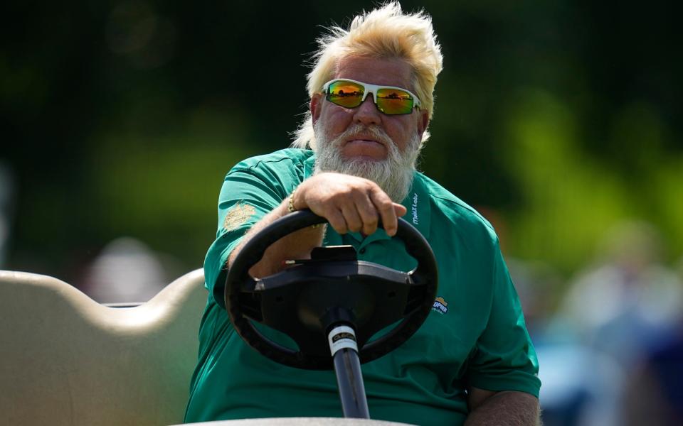 John Daly drives on the 16th hole during the first round of the PGA Championship - AP